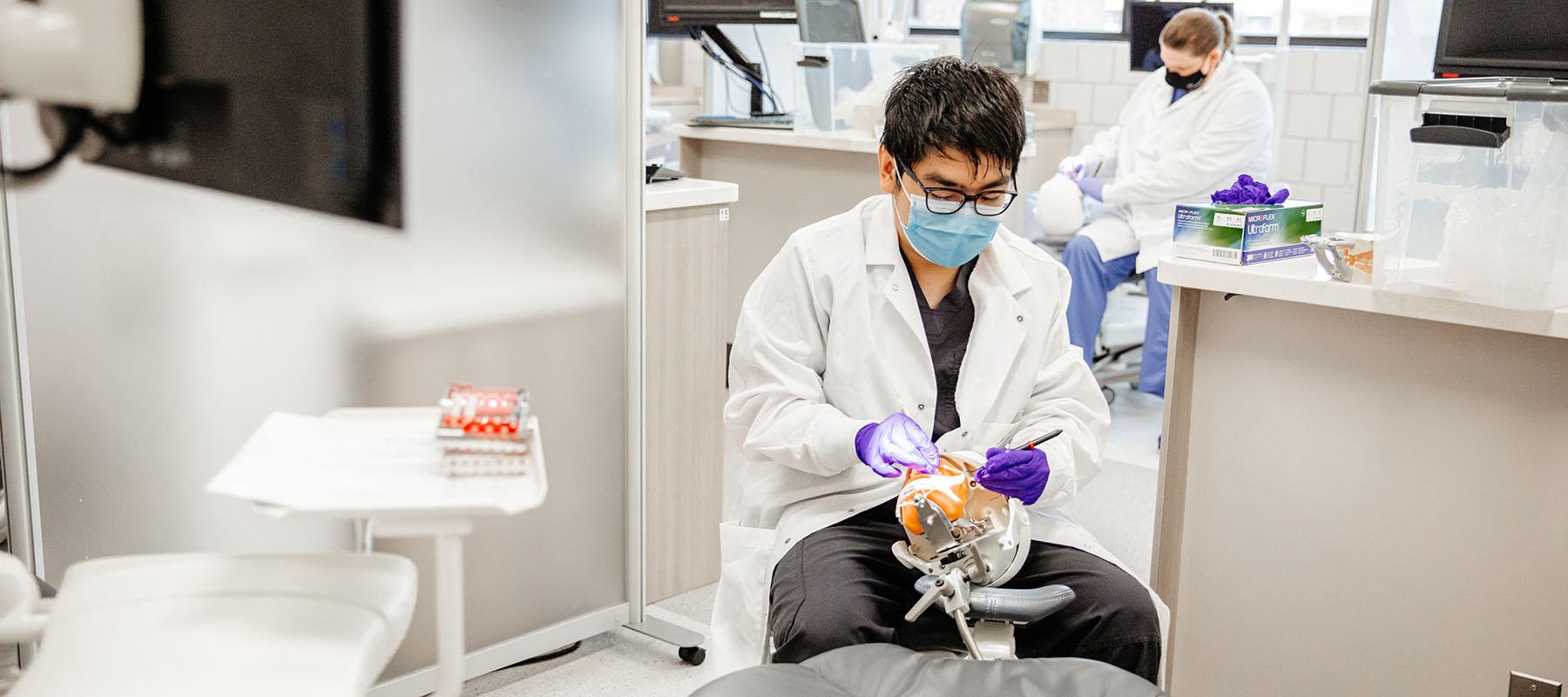 A Dental Hygiene student in a lab.