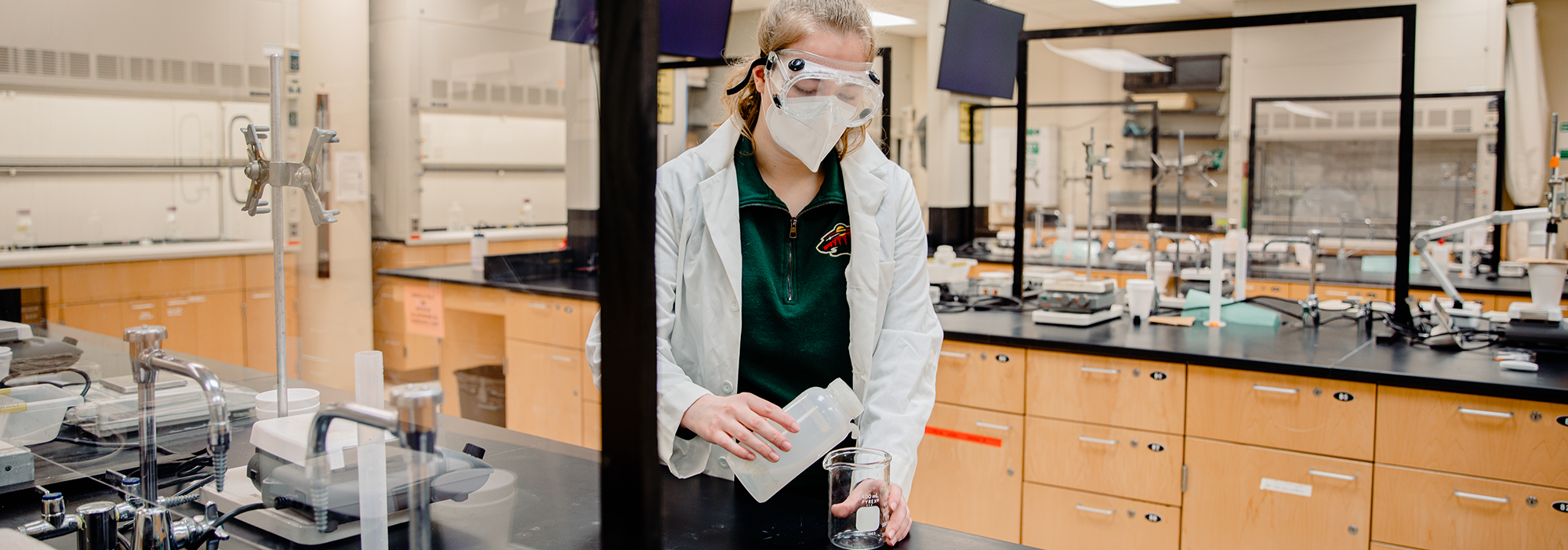 Students using lab equipment while taking chemistry classes  and pursuing their Associate Degree in Chemistry from Normandale Community College.