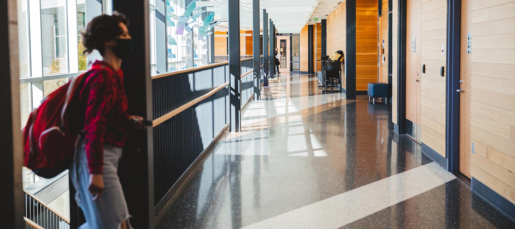 A student walks through the Partnership Center.