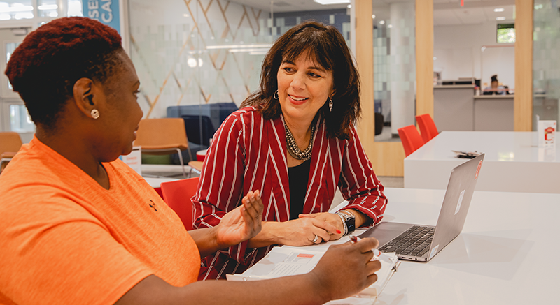 A Normandale adult student gets coaching from an advisor.