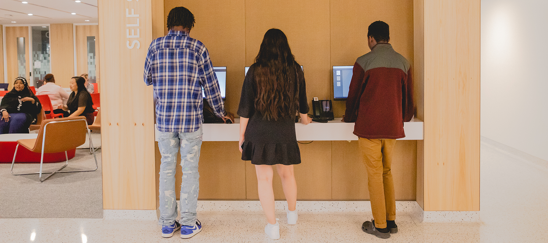 Students applying for financial aid at computers