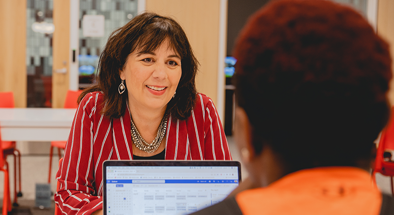 A Normandale Advisor speaks with a student.