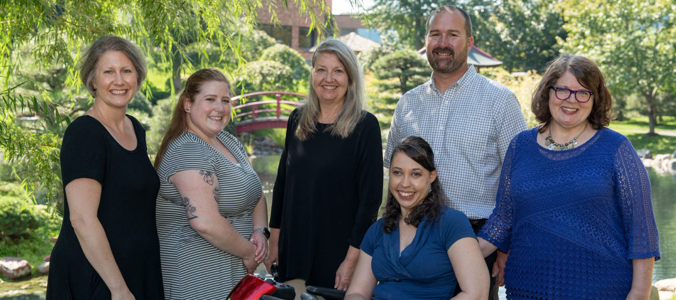 The Office of Students with Disabilities Staff pose in the Japanese Garden.