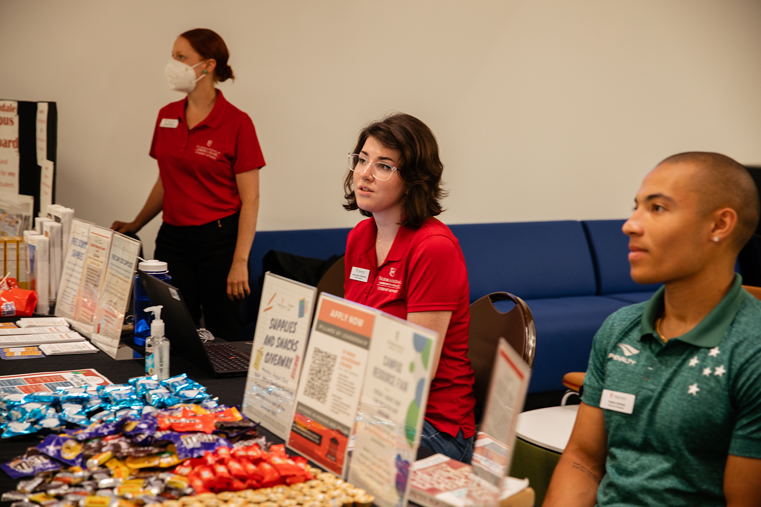 Two students at fair table