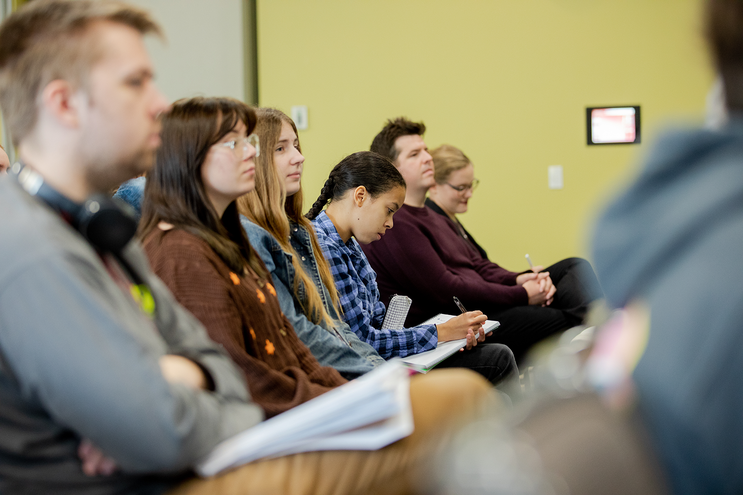 students on chairs in aisle