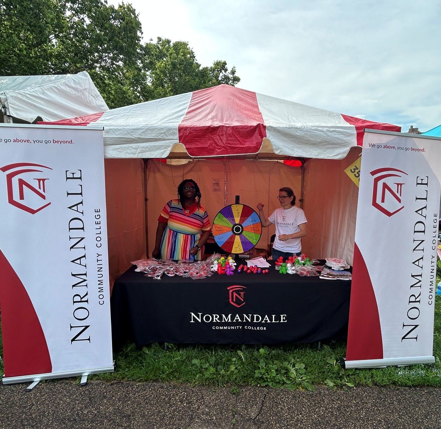Normandale staff working at Normandale's table at the Pride event