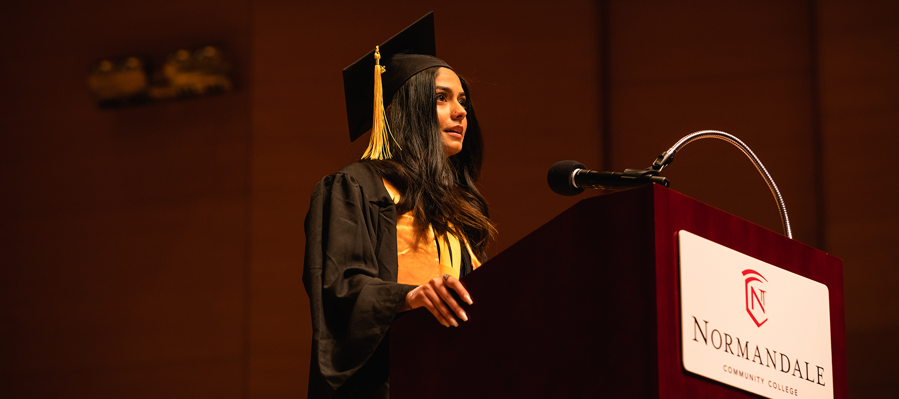 Normandale '22 Commencement student speaker Insia Kizilbash speaks at graduation.