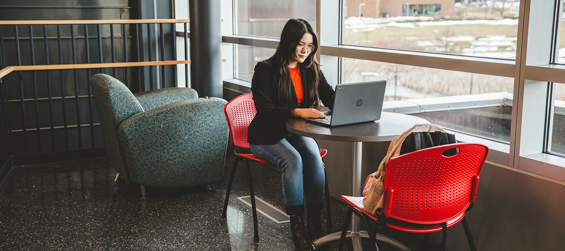 A Normandale student on a laptop.