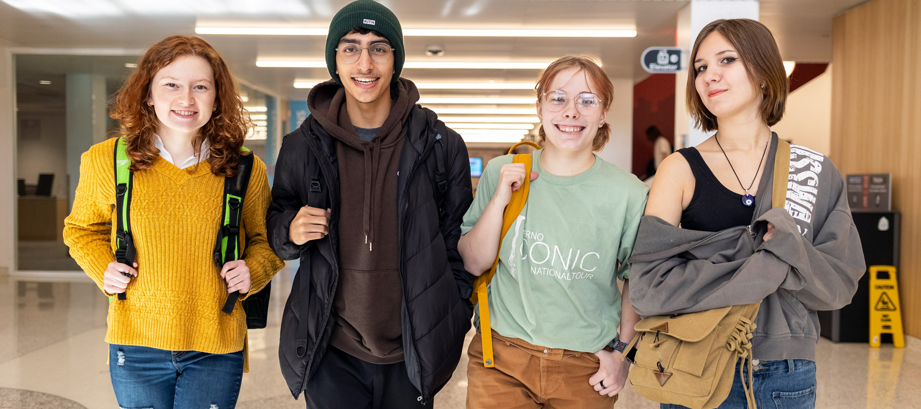 Happy Normandale students walking in the hall