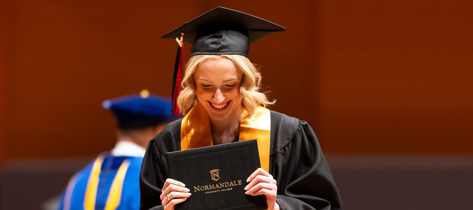 Happy Normandale Graduate with her diploma