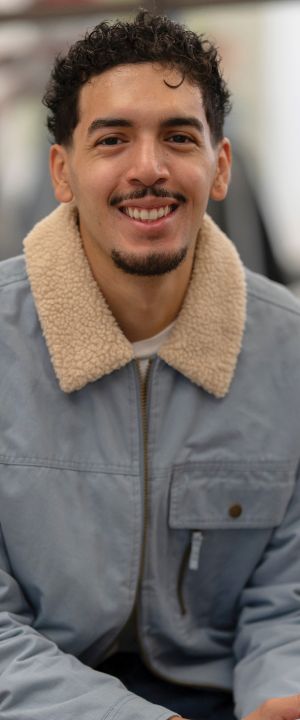 A Normandale student smiles at the camera