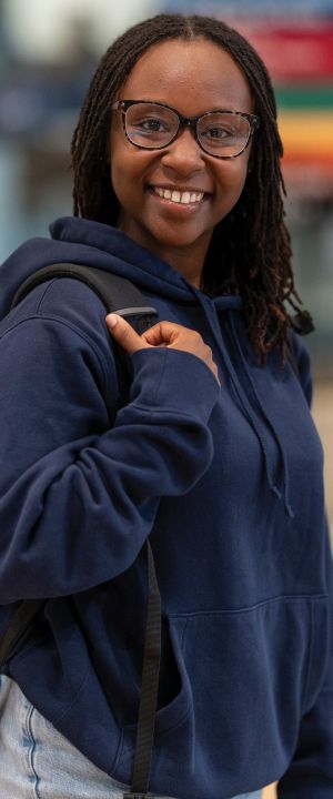 A Normandale student smiles at the camera