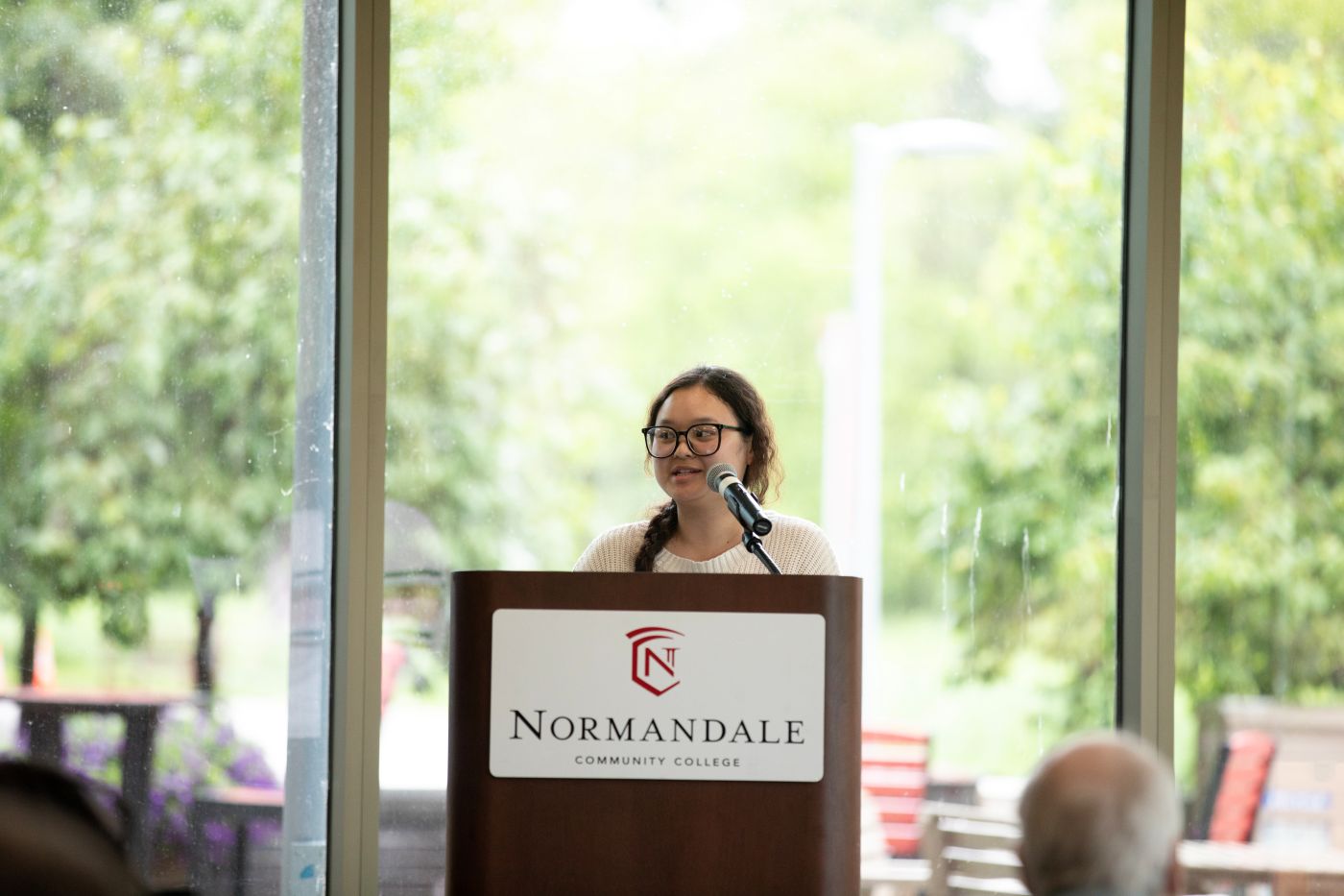 Program Graduate Mue Hsae speaks to partners and audience