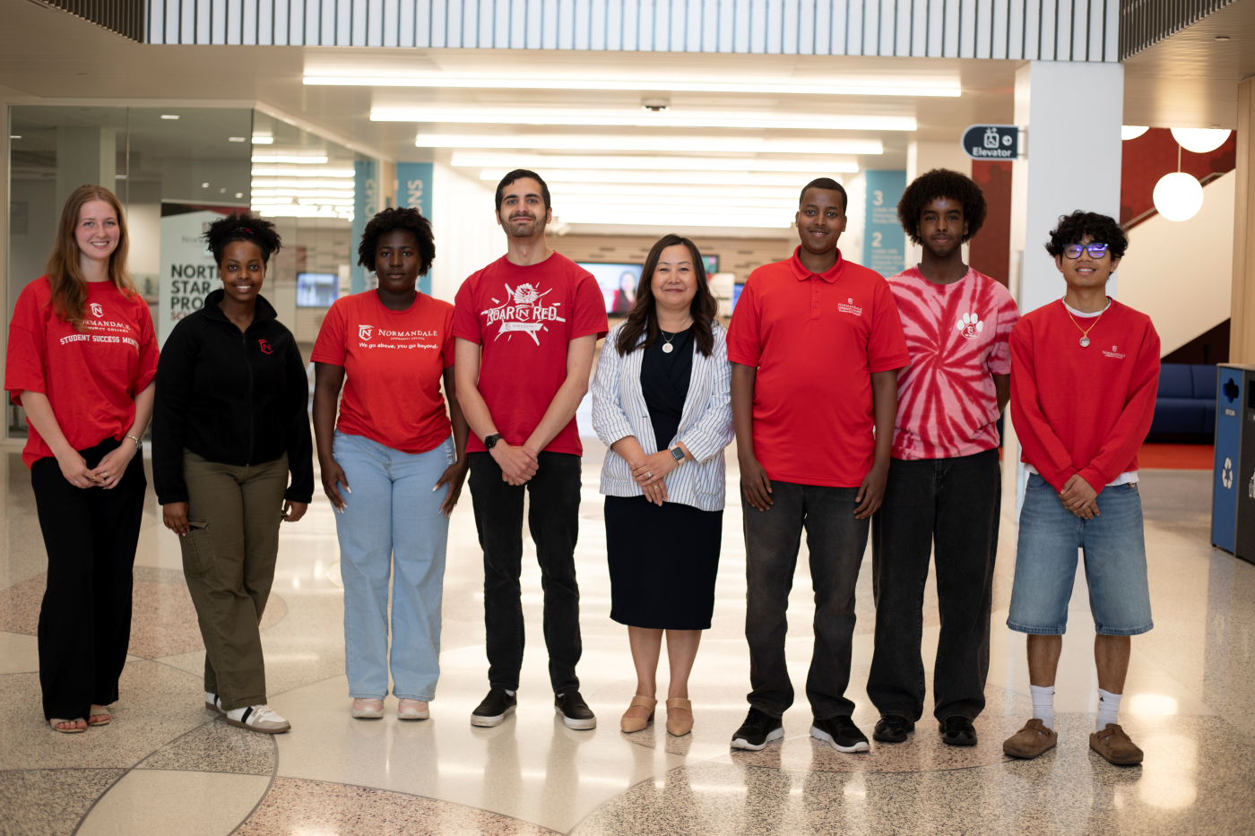 Interim President Pakou Yang with student ambassadors