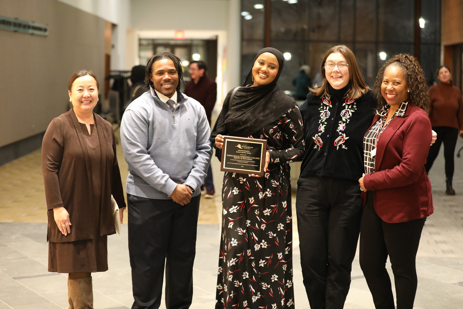 Associate VP of Equity and Inclusion Corey Crowder with group at Bonderud ceremony