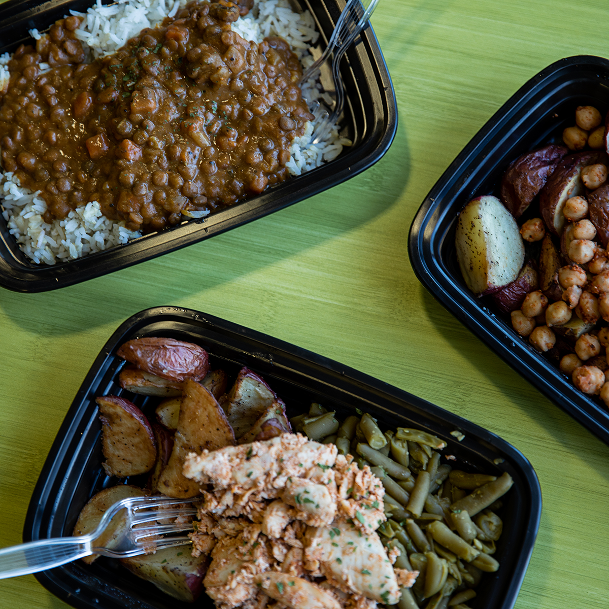 A to-go dish of beans and rice