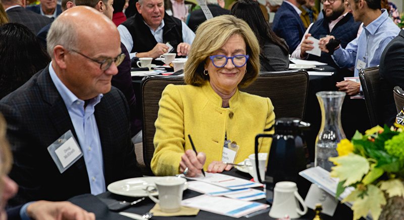 People at a round banquet table.