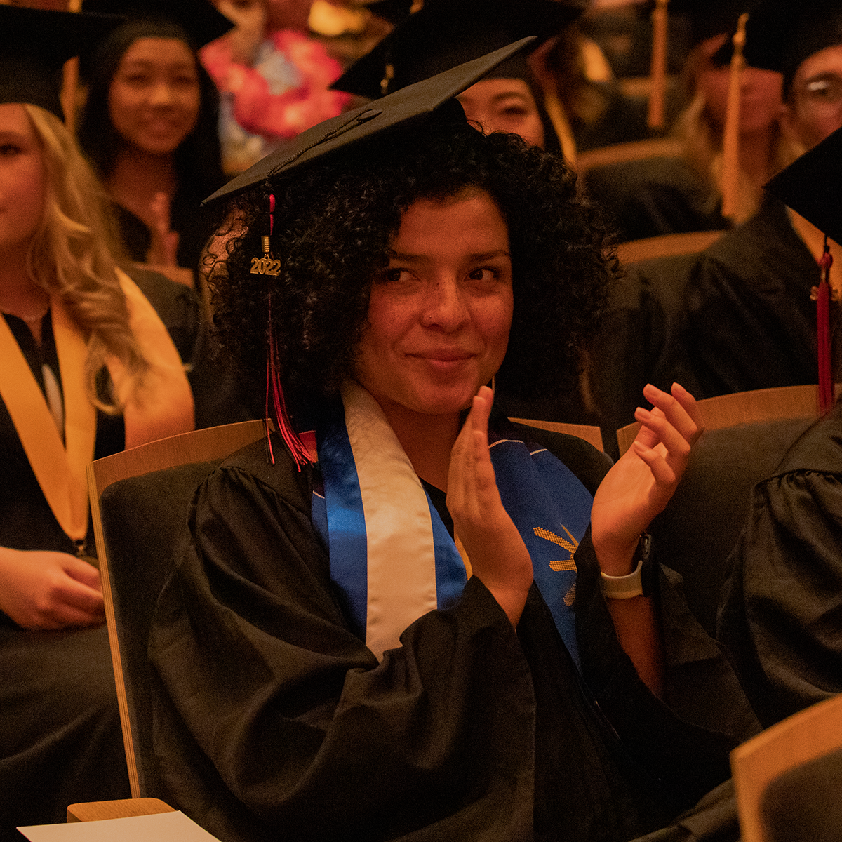 female graduate wearing cap and gown