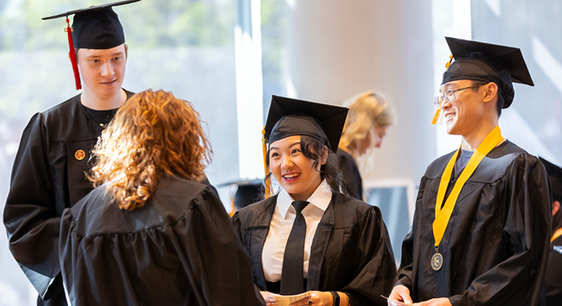  Normandale graduates smile.